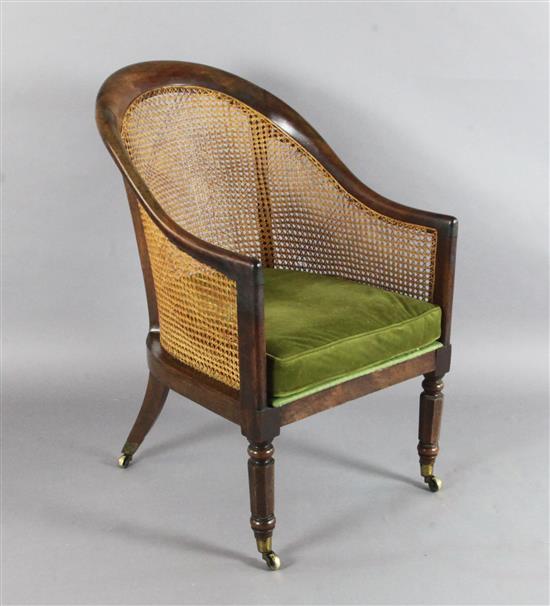 A Regency mahogany bergere library chair, W.1ft 11in. D.2ft 4in. H.3ft
